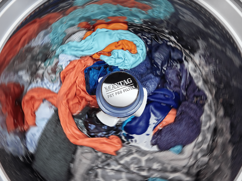Clothes spinning in a Maytag® washer with a Pet Pro Filter