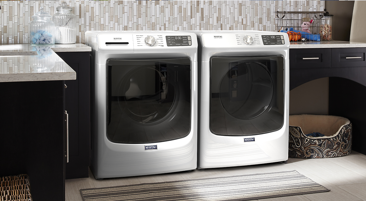 White Maytag® front load washer pair in laundry room