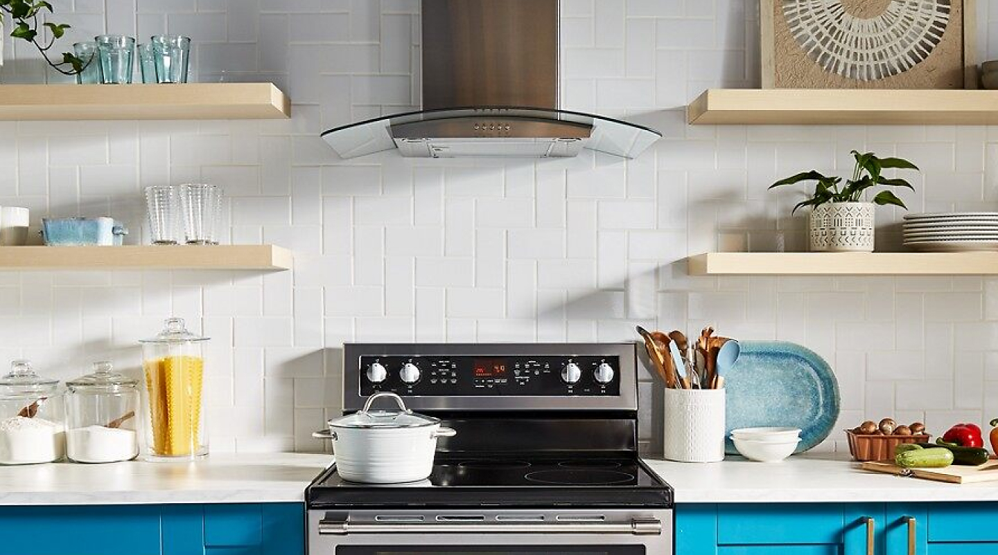 View of kitchen with Maytag® range and range hood