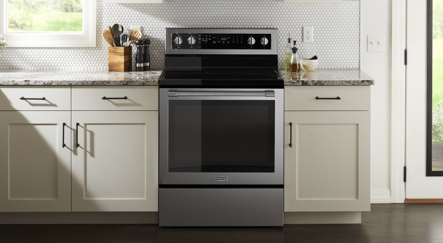 A Maytag® electric range in a modern kitchen