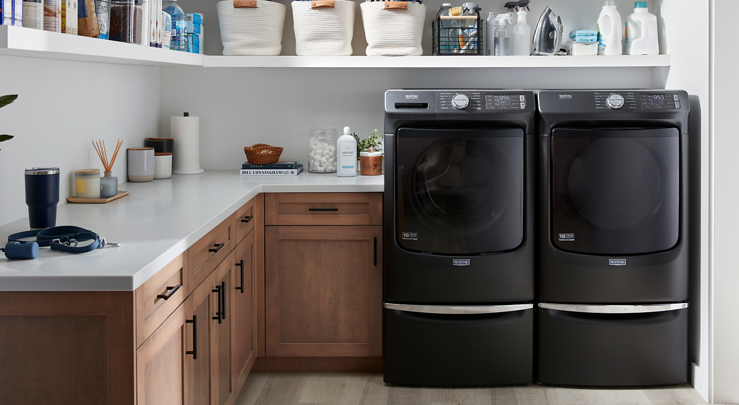 A laundry room featuring a Maytag® washer and dryer