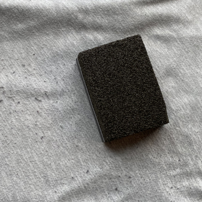 A sweater stone on a pair of sweatpants with fabric pills