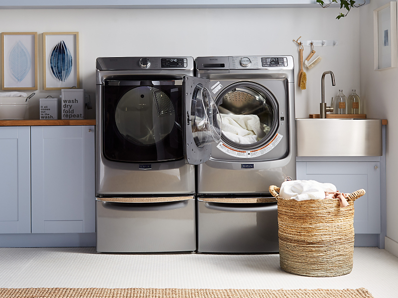 Metallic gray Maytag® front load washer and dryer