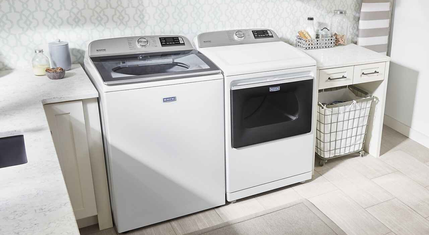 A laundry room featuring a Maytag® washer and dryer
