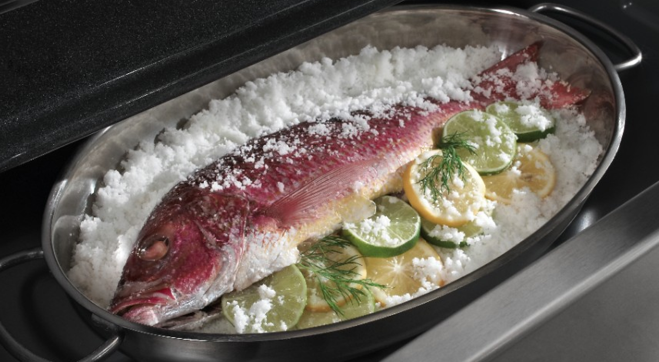 Fish in a large tray in a variety of garnishes