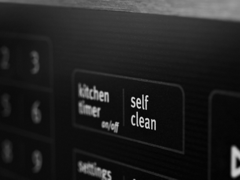 Close-up of self clean button on oven control panel