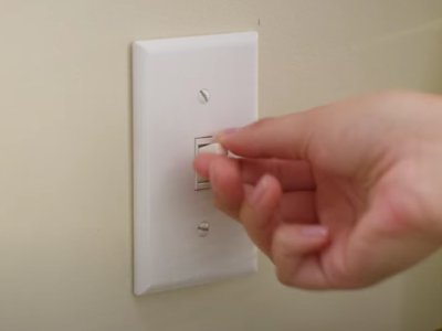 Person flipping a disposal switch