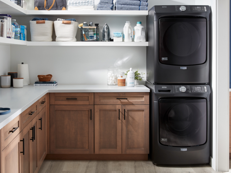 Stacked Maytag® washer and dryer in laundry room