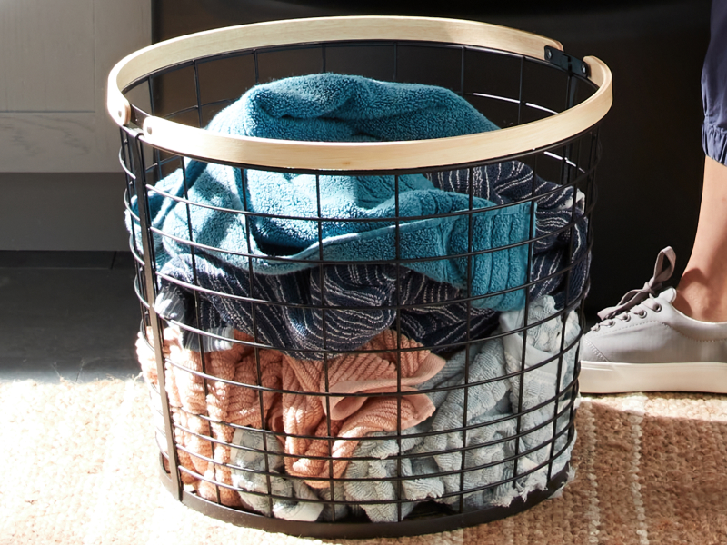 Wire laundry basket filled with towels