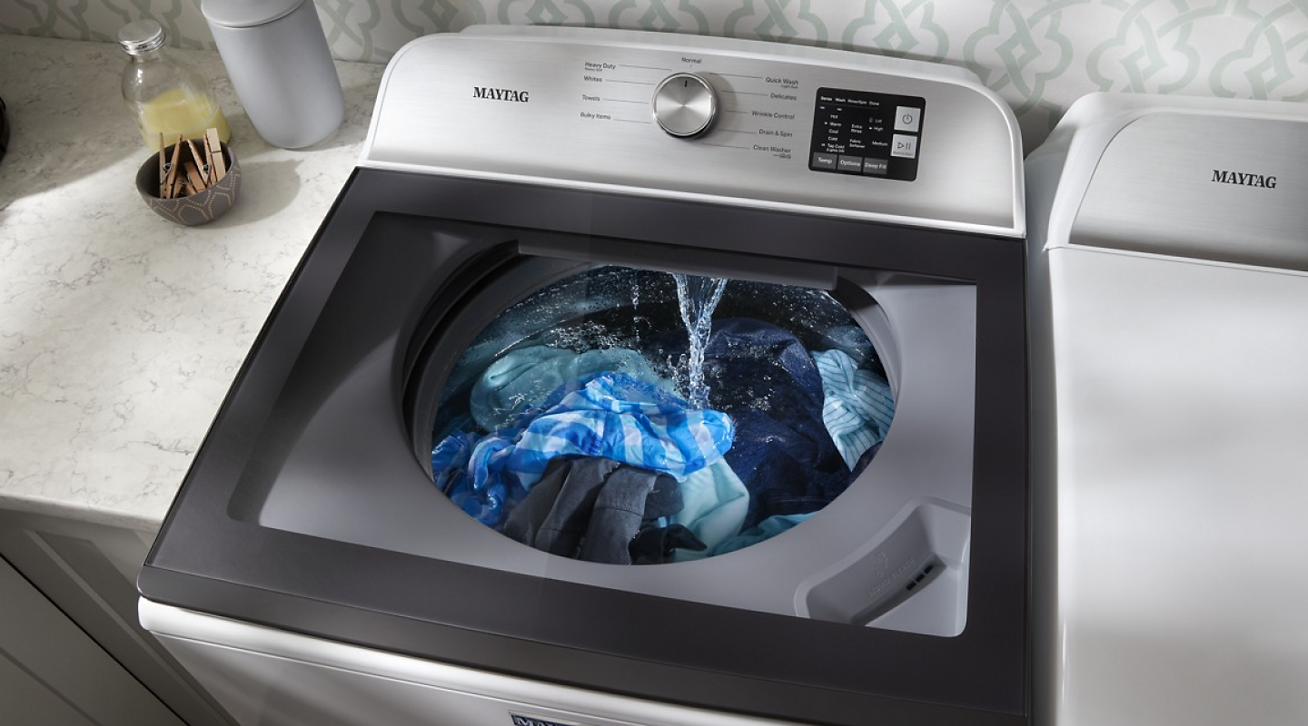 Clothes in Maytag® top load washer during wash cycle