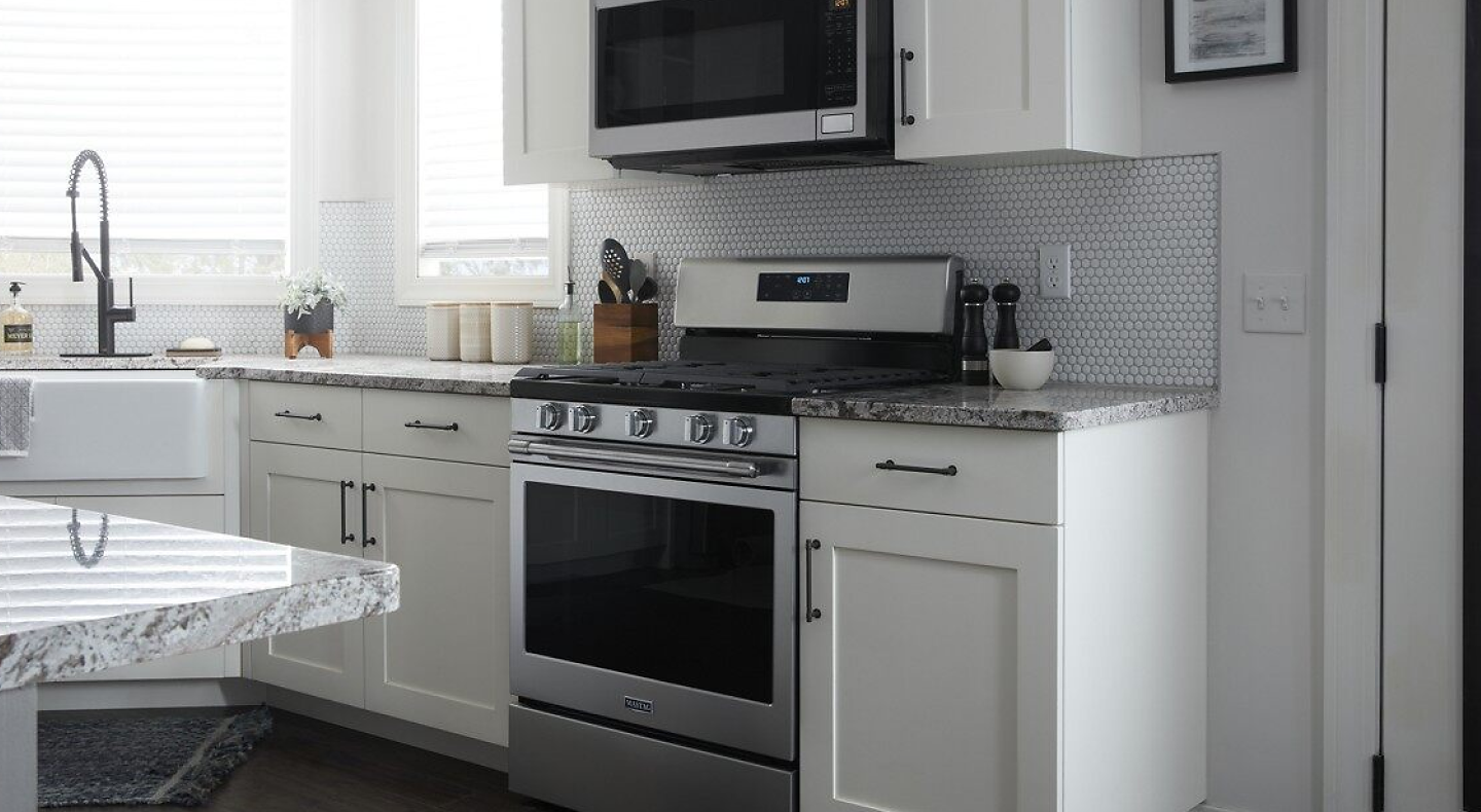 Maytag® gas range inside a modern kitchen