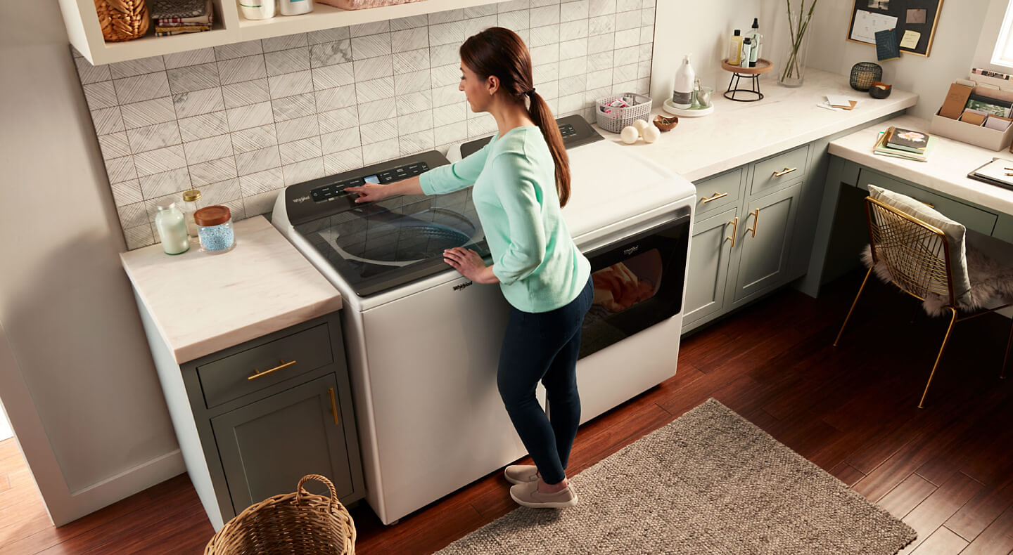 Overhead view of woman at washing machine