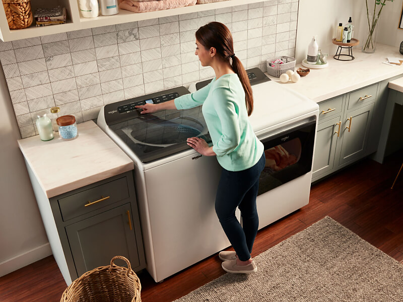 Overhead view of woman at washing machine