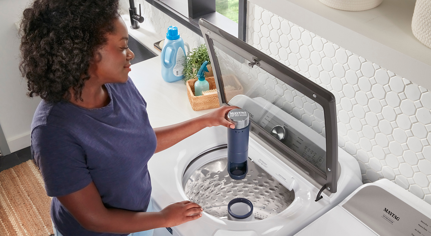 Person removing Maytag® Pet Pro Filter