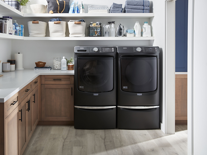 Laundry room featuring Maytag® washer and dryer.