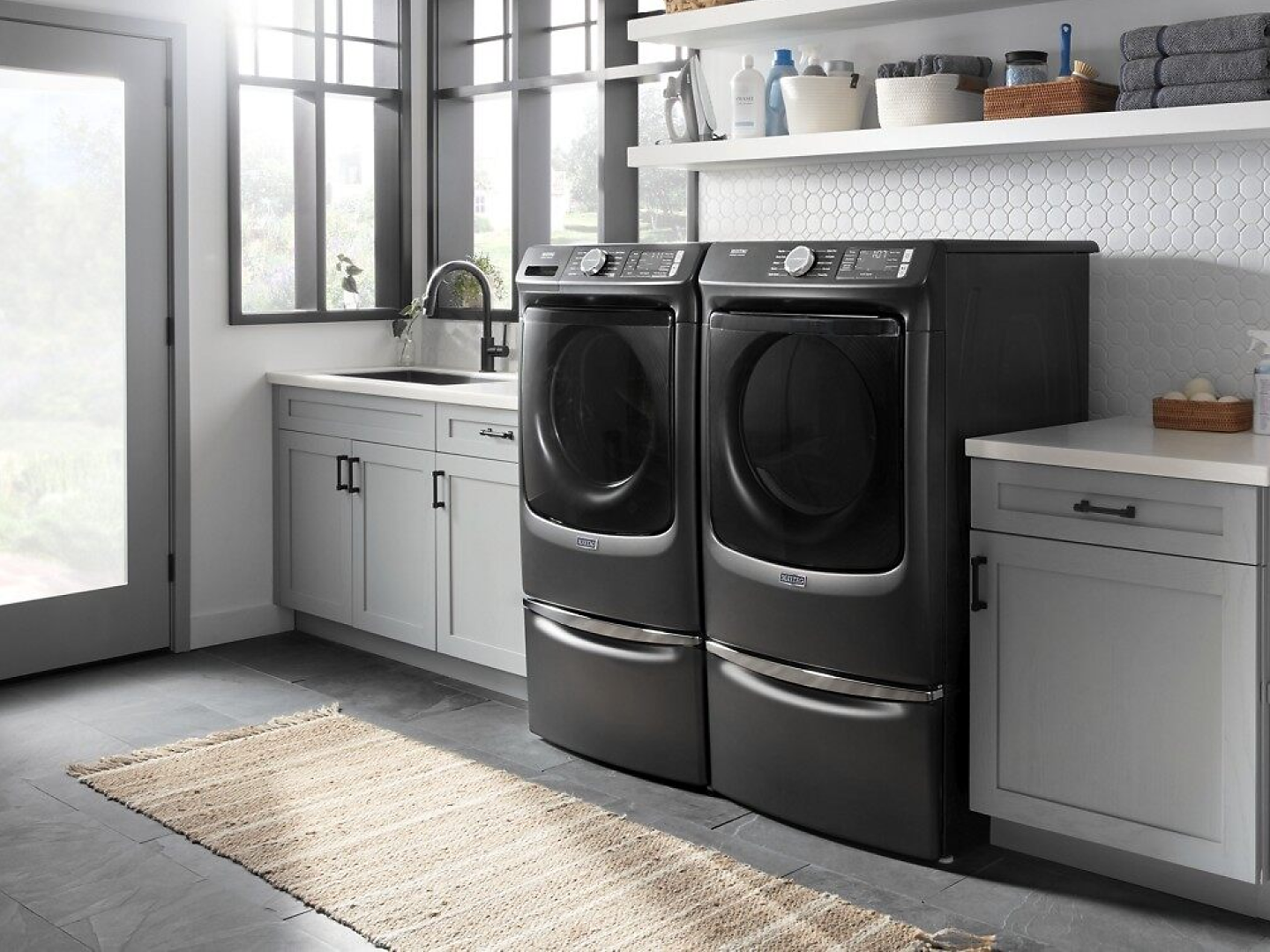 A laundry room featuring a Maytag® washing machine and dryer