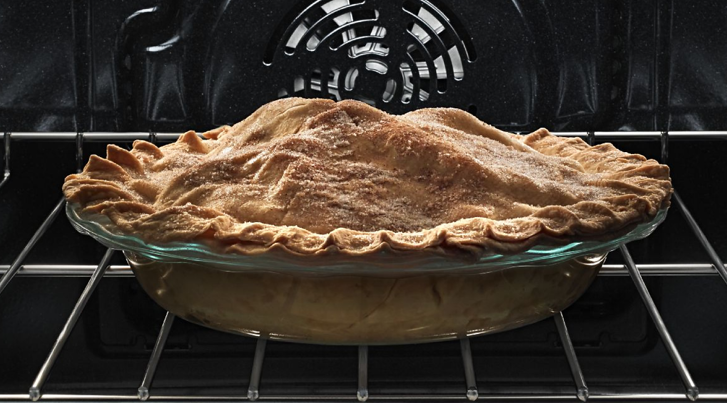 A pie baking in an oven.
