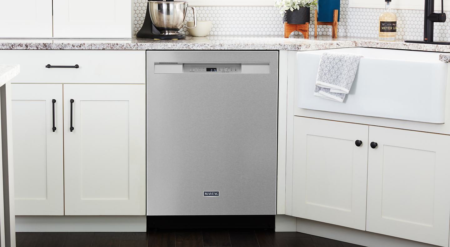 A stainless steel Maytag® dishwasher in a modern kitchen
