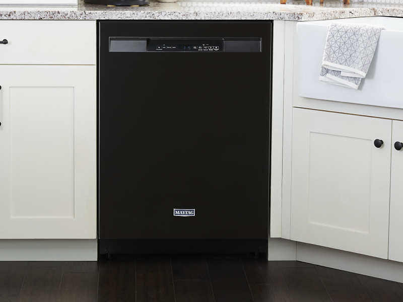 A black Maytag® dishwasher in a modern kitchen