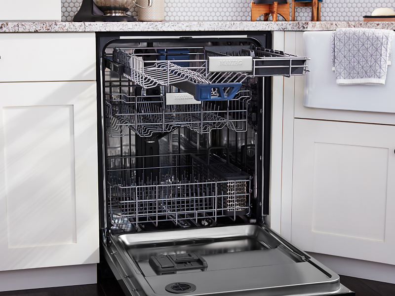 An empty dishwasher with the door open