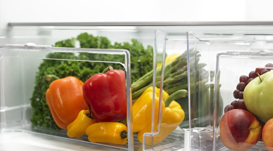 Vegetables and fruits stored in fridge bins