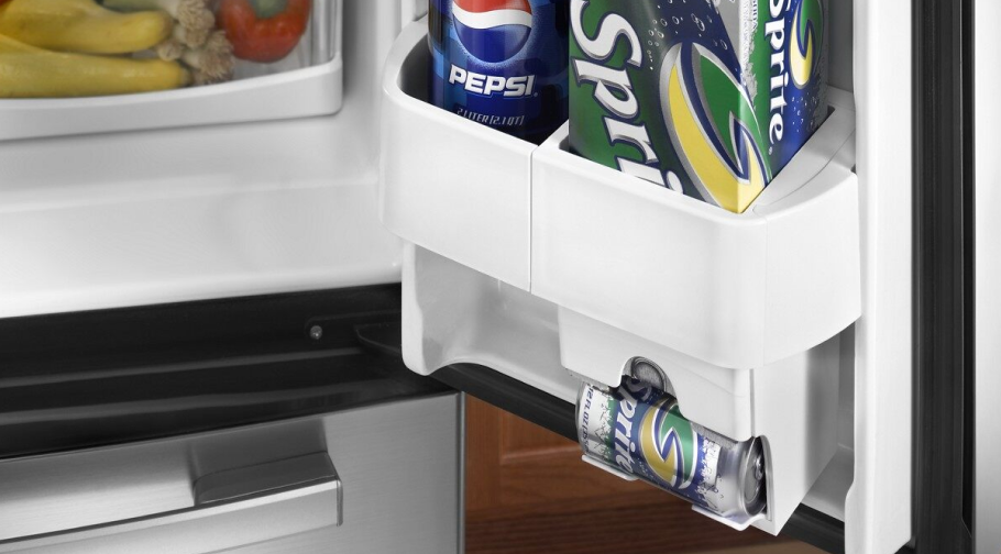 A drinker dispenser in the side of a refrigerator