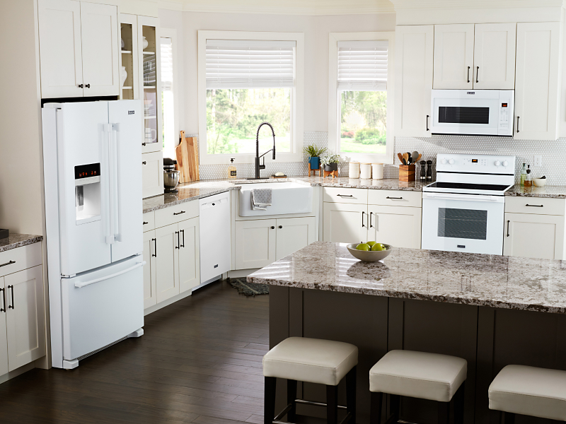 White appliances in a kitchen setting with white cabinets