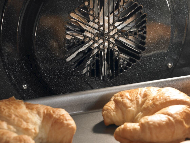 Croissants baking in convection oven