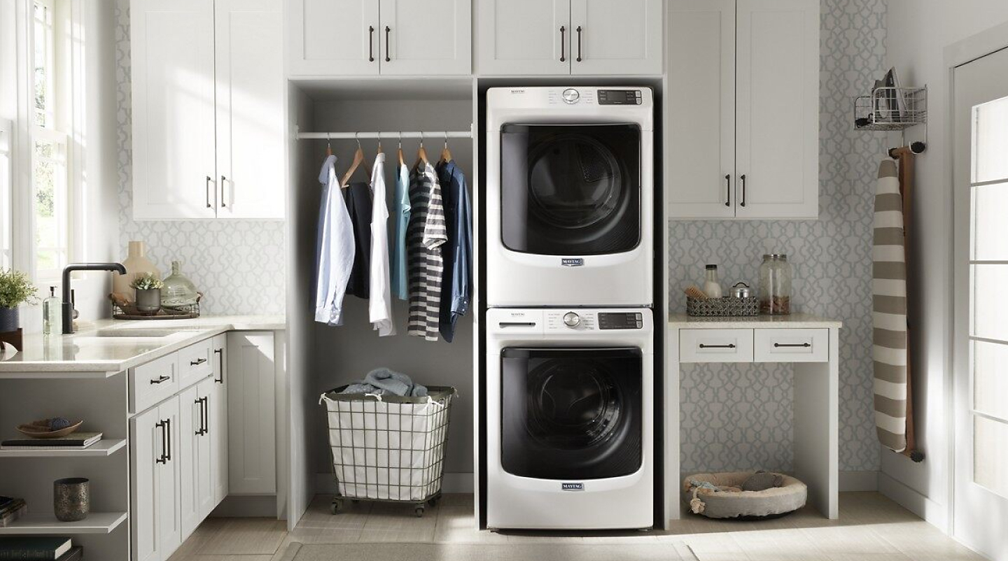 Stacked Maytag® washer and dryer in laundry room