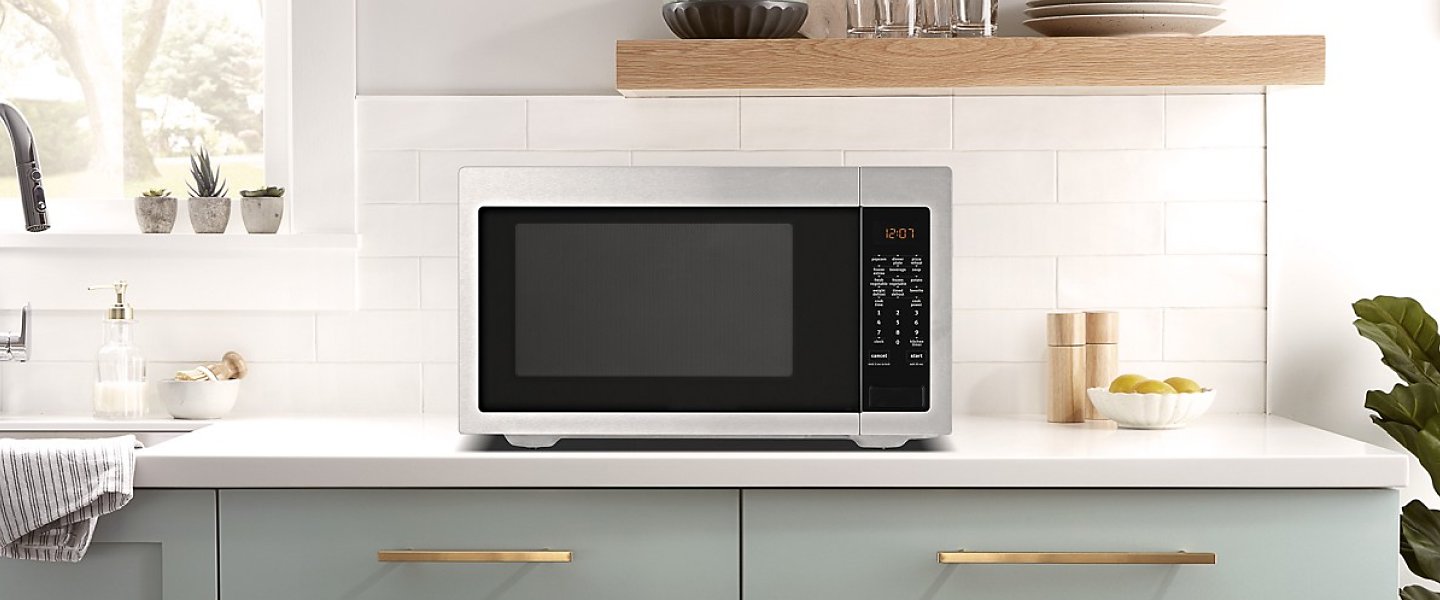 Stainless steel microwave on a counter Stainless steel microwave on a counter