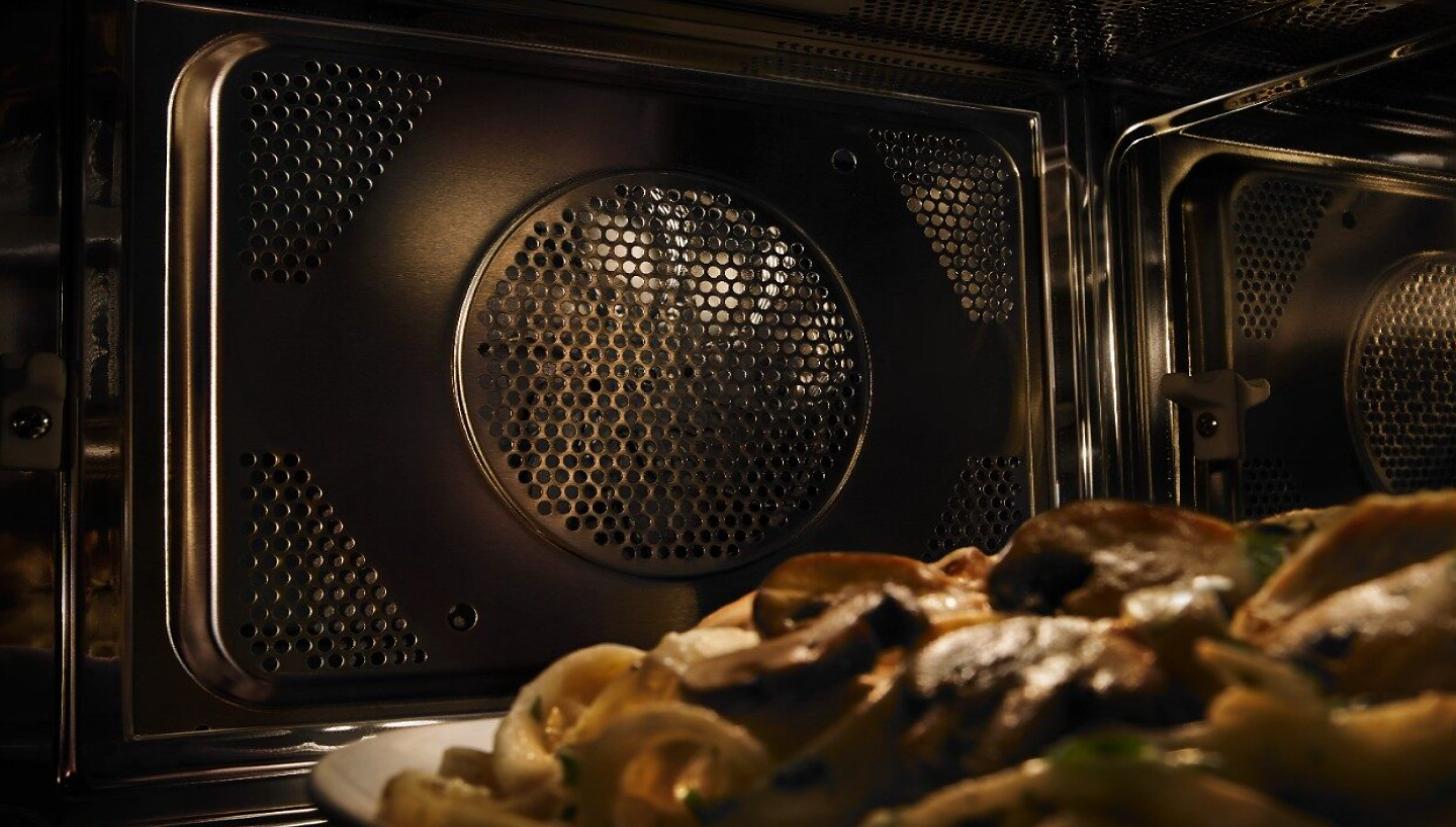 Close up of convection fan inside a microwave