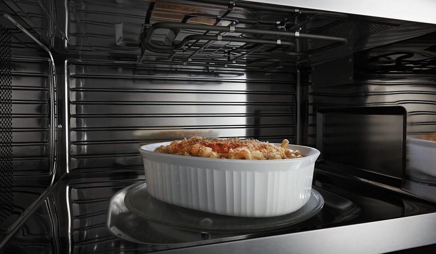 Macaroni and cheese crisping inside a microwave Macaroni and cheese crisping inside a microwave