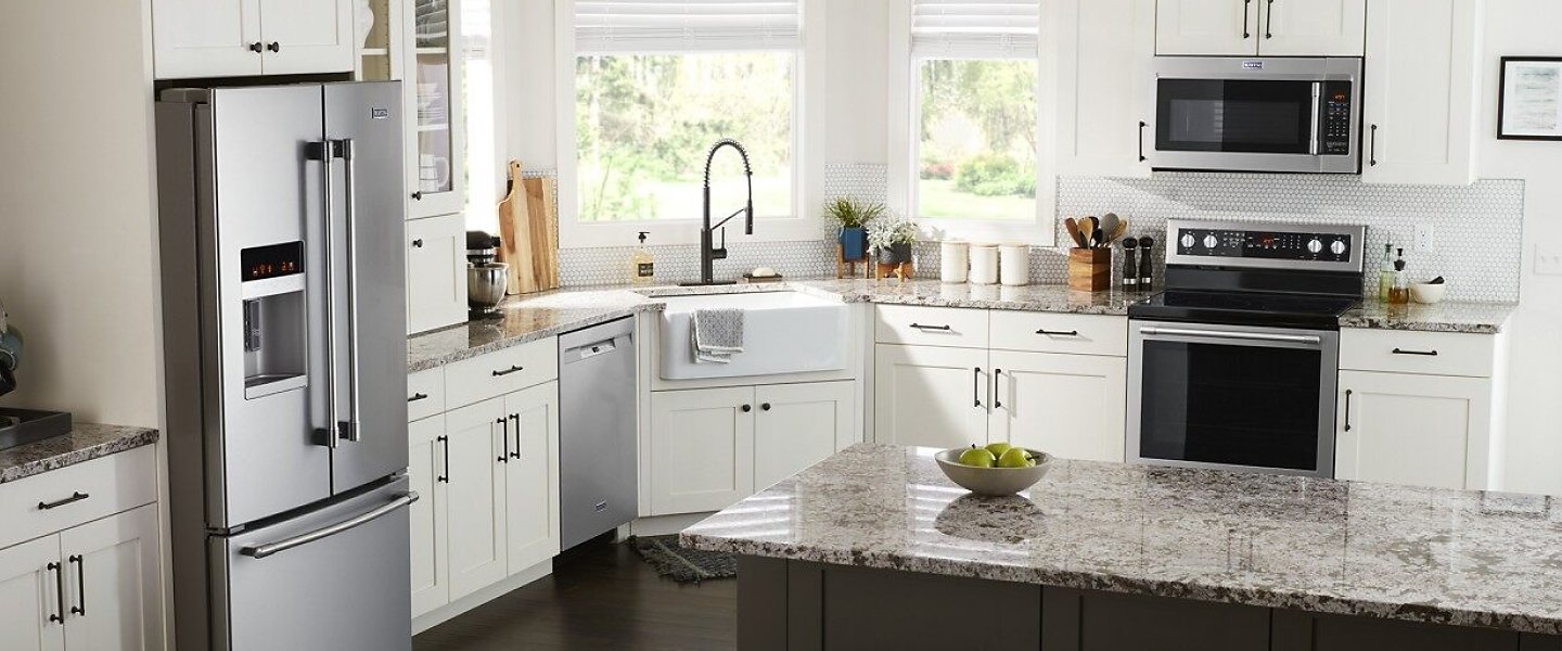 Suite of appliances in a bright, white kitchen Suite of appliances in a bright, white kitchen