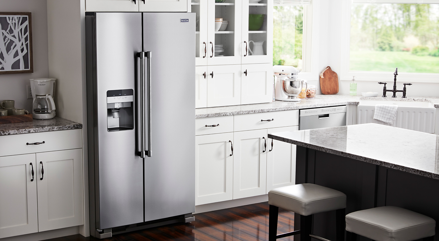 Stainless steel side-by-side refrigerator with built-in ice and water dispenser