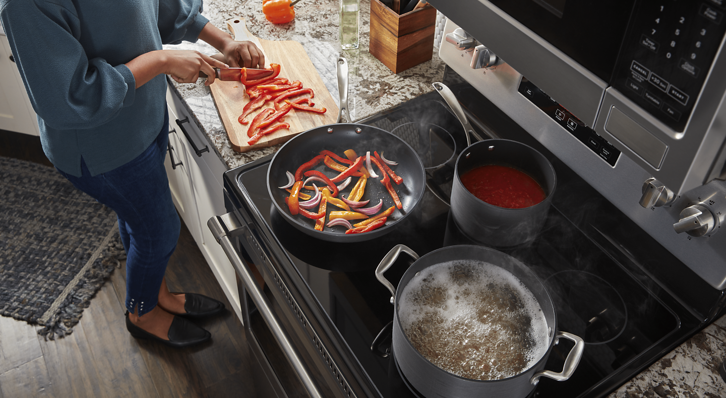 https://kitchenaid-h.assetsadobe.com/is/image/content/dam/business-unit/maytag/en-us/marketing-content/site-assets/page-content/oc-articles/update-your-stove-from-gas-to-electric/Update-Stove-Gas-to-Electric_1.png?fmt=png-alpha&qlt=85,0&resMode=sharp2&op_usm=1.75,0.3,2,0&scl=1&constrain=fit,1
