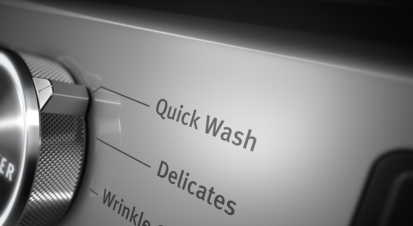 Close up of control panel knob set on Quick Wash cycle