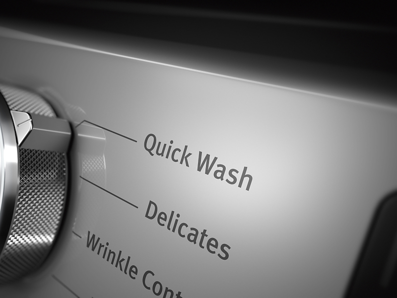 Close up of control panel knob set on Quick Wash cycle