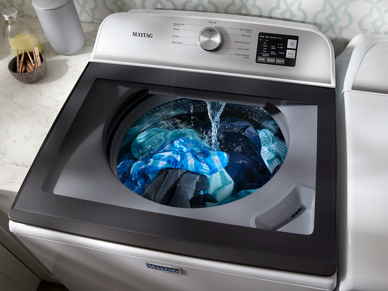 Laundry being cleaned in a Maytag® washing machine set to a normal cycle
