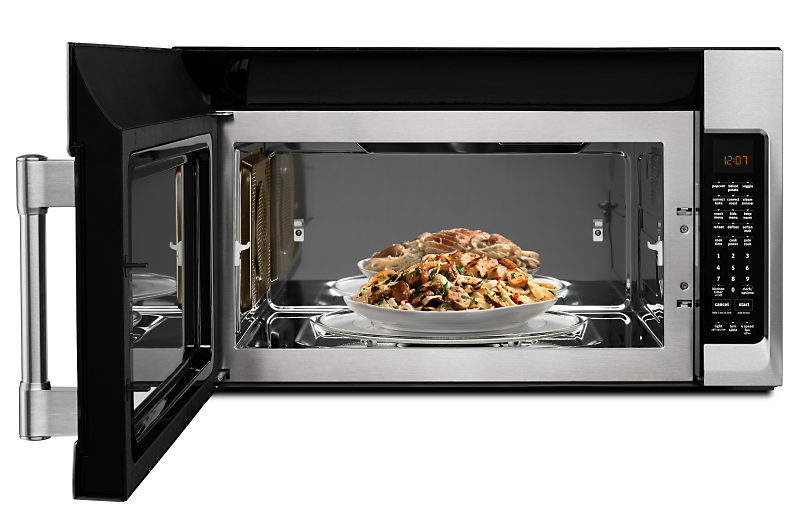 A bowl of food sits inside a Maytag® convection microwave.