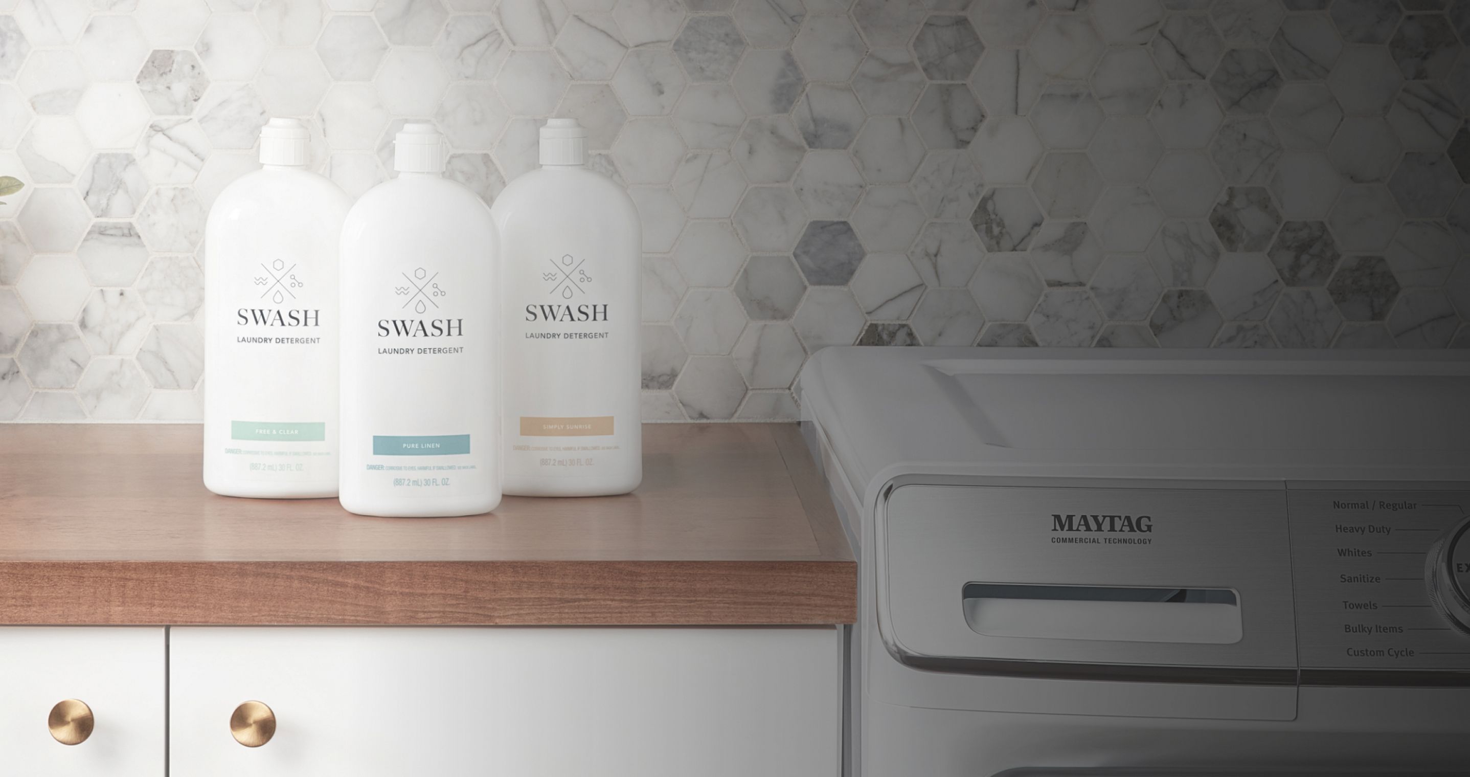 Three bottles of Swash® Laundry Detergent.