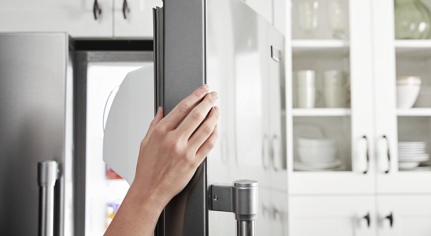 A person opens the door of a Maytag® counter-depth refrigerator. A person opens the door of a Maytag® counter-depth refrigerator.