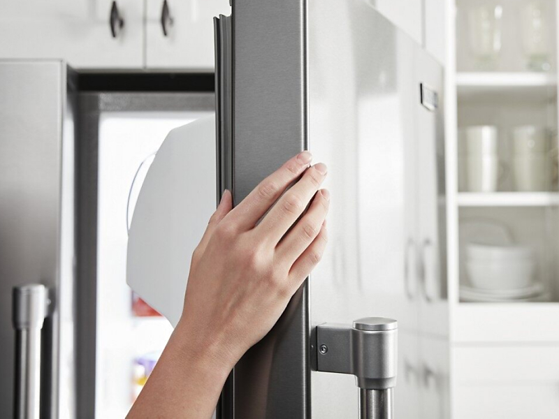 A person opens the door of a Maytag® counter-depth refrigerator. A person opens the door of a Maytag® counter-depth refrigerator.