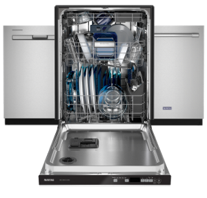 An open Maytag® dishwasher with dishes inside.