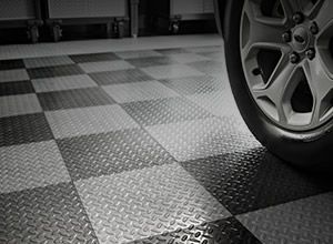 a garage floor with car tire
