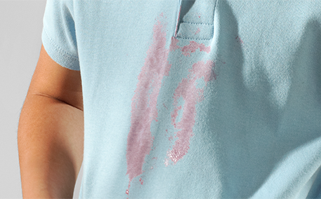 A pink stain on a light blue shirt.