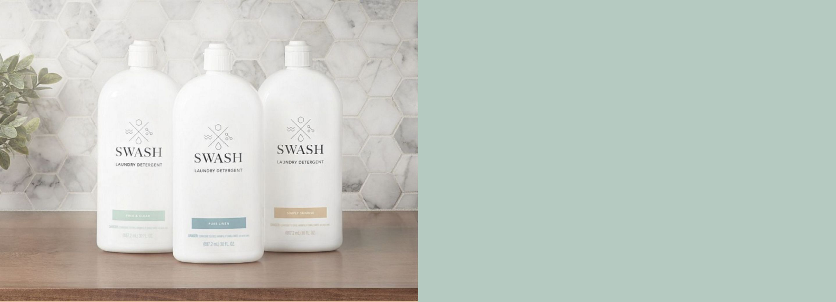 Three bottles of Swash Laundry Detergent on a wooden shelf.  