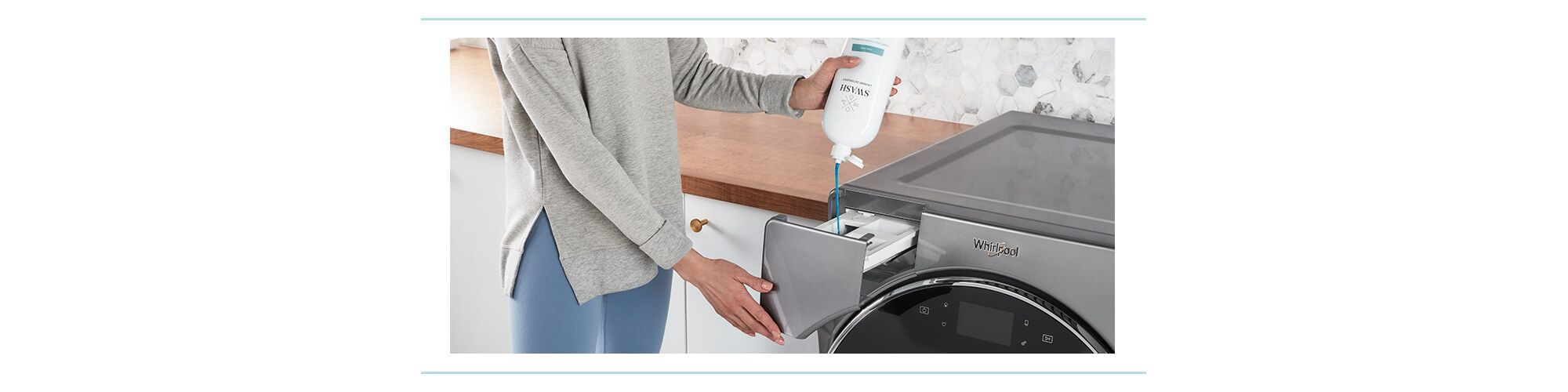 Woman in a gray sweatshirt dispensing Swash laundry detergent using the Precision Pour Cap into a Whirlpool washing machine
