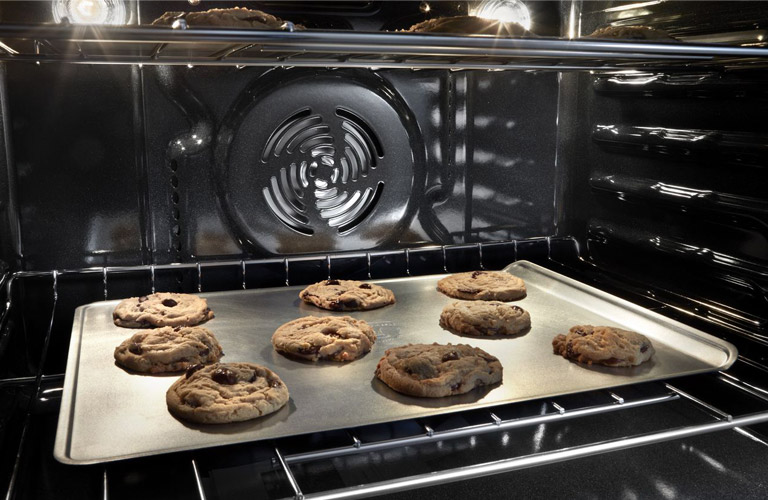 Fan and True Convection Oven Interior Photo with Cookies Baking
