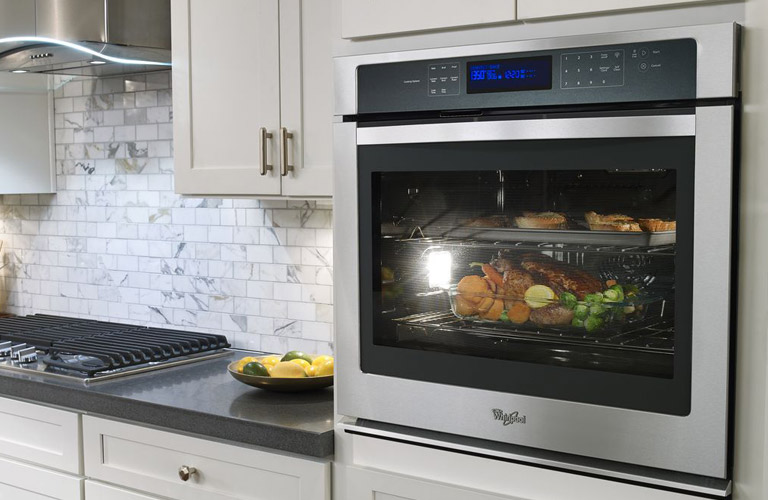 Whirlpool Built-In Wall Oven With Roast and Vegetables Cooking Inside