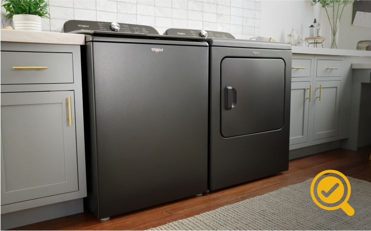 A laundry room with a Whirlpool® Top Load Washer and Dryer